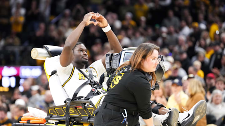 Jan 31, 2026; Columbia, Missouri, USA; Missouri Tigers guard Annor Boateng (6) signals to fans as he is carted off the court by medical personnel after an injury against the Mississippi State Bulldogs during the second half of the game at Mizzou Arena. Mandatory Credit: Denny Medley-Imagn Images