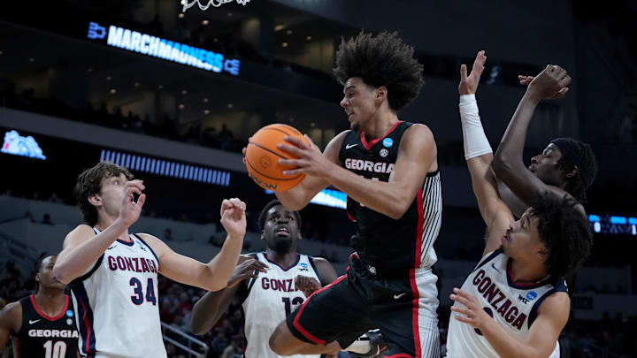 Mar 20, 2025; Wichita, KS, USA; Georgia Bulldogs forward Asa Newell (14) rebounds against Gonzaga Bulldogs forward Braden Huff (34), forward Graham Ike (13) and guard Ryan Nembhard (0) in the first half of a first round men’s NCAA Tournament game at Intrust Bank Arena. Mandatory Credit: Kirby Lee-Imagn Images
