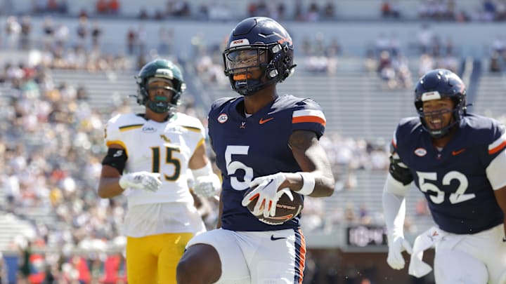 Sep 13, 2025; Charlottesville, Virginia, USA; Virginia Cavaliers wide receiver Kameron Courtney (5) celebrates after scoring a touchdown against the William & Mary Tribe during the first half at Scott Stadium. Mandatory Credit: Amber Searls-Imagn Images
