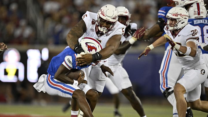 Sep 28, 2024; Dallas, Texas, USA; Florida State Seminoles defensive lineman Joshua Farmer (5) and linebacker Blake Nichelson (20) and Southern Methodist Mustangs quarterback Kevin Jennings (7) in action during the game between the Southern Methodist Mustangs and the Florida State Seminoles at Gerald J. Ford Stadium. Mandatory Credit: Jerome Miron-Imagn Images