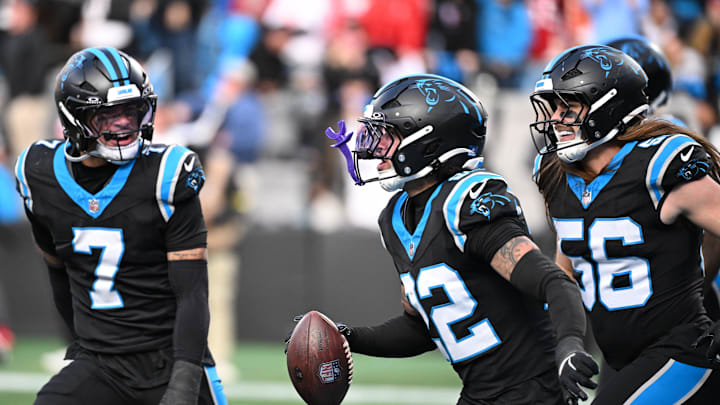 Dec 21, 2025; Charlotte, North Carolina, USA;  Carolina Panthers safety Lathan Ransom (22) celebrates with safety Tre'Von Moehrig (7) and linebacker Christian Rozeboom (56) after intercepting the ball to seal the victory in the fourth quarter at Bank of America Stadium. Mandatory Credit: Bob Donnan-Imagn Images