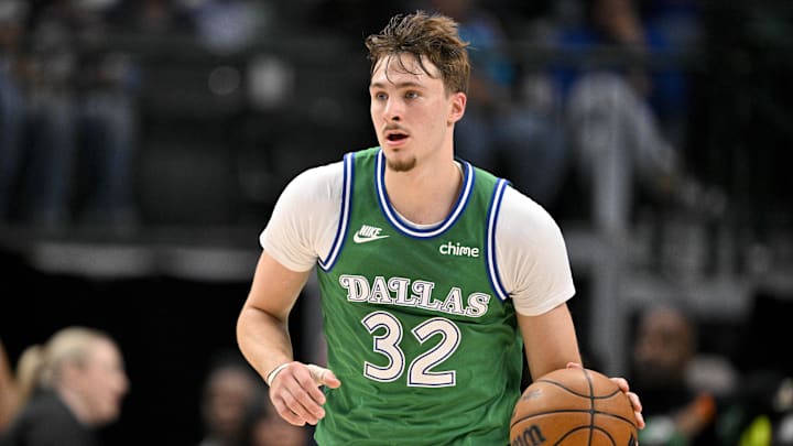 Nov 12, 2025; Dallas, Texas, USA; Dallas Mavericks forward Cooper Flagg (32) brings the ball up court against the Phoenix Suns during the second quarter at the American Airlines Center. Mandatory Credit: Jerome Miron-Imagn Images