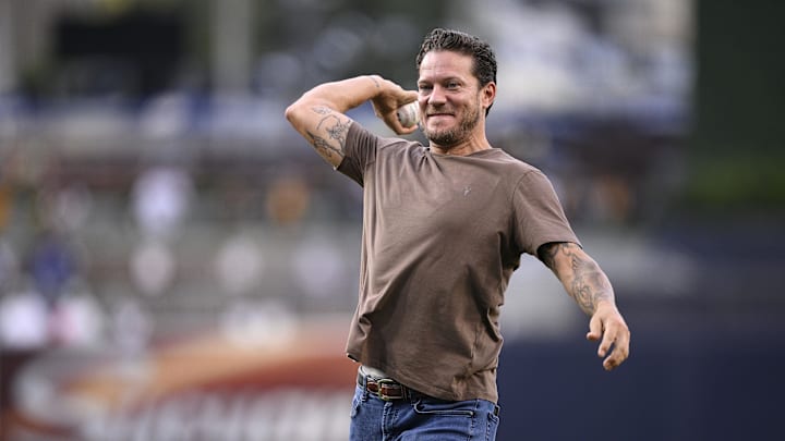 Jul 28, 2023; San Diego, California, USA; San Diego Padres former pitcher Jake Peavy throws out the ceremonial first pitch before the game against the Texas Rangers at Petco Park. Peavy was inducted into the Padres Hall of Fame prior to the game. 