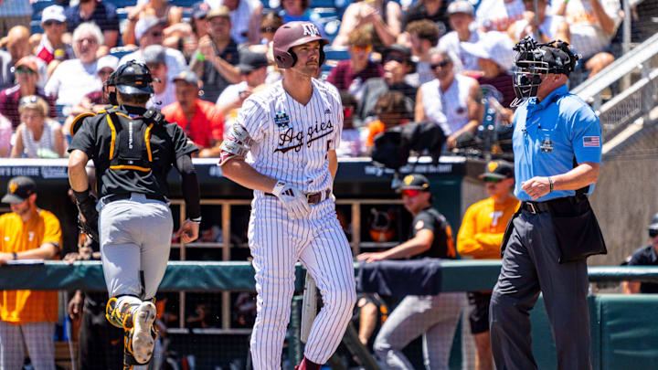 Jun 23, 2024; Omaha, NE, USA; Texas A&M Aggies designated hitter Hayden Schott (5) reacts after striking out against the Tennessee Volunteers to end the first inning at Charles Schwab Field Omaha. Mandatory Credit: Dylan Widger-USA TODAY Sports