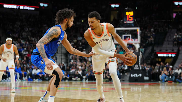 Mar 19, 2024; San Antonio, Texas, USA;  San Antonio Spurs center Victor Wembanyama (1) faces off against Dallas Mavericks center Dereck Lively II (2) in the first half at Frost Bank Center. Mandatory Credit: Daniel Dunn-Imagn Images