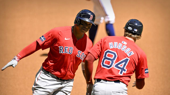 Mar 26, 2024; Arlington, Texas, USA; Boston Red Sox third baseman Rafael Devers (11) rounds the