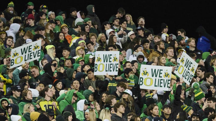 Nov 24, 2023; Eugene, Oregon, USA; Oregon Ducks fans hold up signs during the second half against the Oregon State Beavers at Autzen Stadium. Mandatory Credit: Troy Wayrynen-USA TODAY Sports Nov 24, 2023; Eugene, Oregon, USA; Oregon Ducks fans hold up signs during the second half against the Oregon State Beavers at Autzen Stadium. Mandatory Credit: Troy Wayrynen-USA TODAY Sports