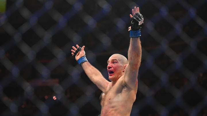 May 9, 2026; Newark, New Jersey, UNITED STATES; Sean Strickland (blue gloves) celebrates after defeating Khamzat Chimaev (red gloves) during UFC 328 at Prudential Center. Mandatory Credit: John Jones-Imagn Images