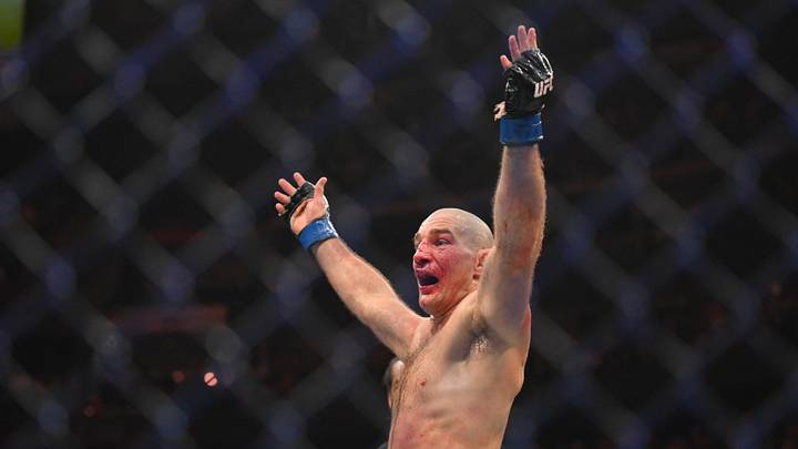 May 9, 2026; Newark, New Jersey, UNITED STATES; Sean Strickland (blue gloves) celebrates after defeating Khamzat Chimaev (red gloves) during UFC 328 at Prudential Center. Mandatory Credit: John Jones-Imagn Images