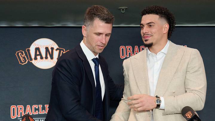 Dec 12, 2024; San Francisco, CA, USA; San Francisco Giants shortstop Willy Adames shakes hands with president of baseball operations Buster Posey during his introductory press conference at Oracle Park.  Mandatory Credit: Robert Edwards-Imagn Images
