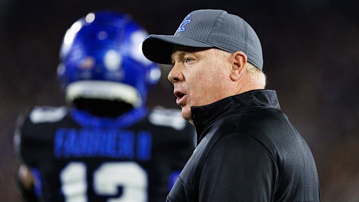Oct 12, 2024; Lexington, Kentucky, USA; Kentucky Wildcats head coach Mark Stoops talks to a referee during the first quarter against the Vanderbilt Commodores at Kroger Field. Mandatory Credit: Jordan Prather-Imagn Images