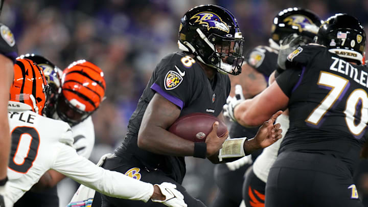 Baltimore Ravens quarterback Lamar Jackson (8) find running room in the second quarter during an NFL