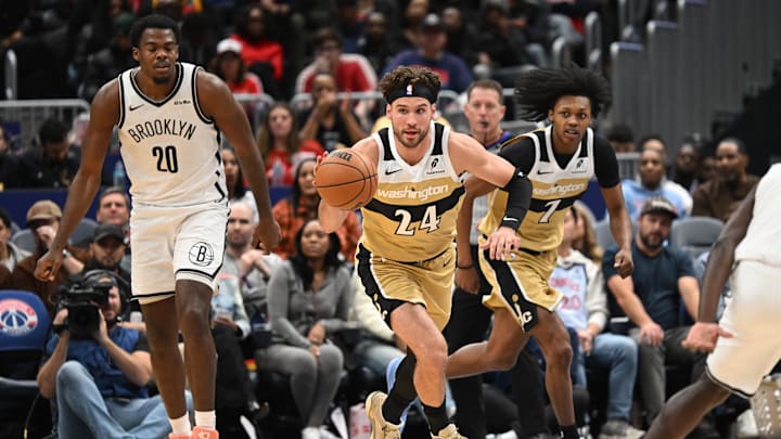 Nov 16, 2025; Washington, District of Columbia, USA;  Washington Wizards forward Corey Kispert (24) dribbles the ball up court against the Brooklyn Nets during the third quarter at Capital One Arena. Mandatory Credit: Rafael Suanes-Imagn Images
