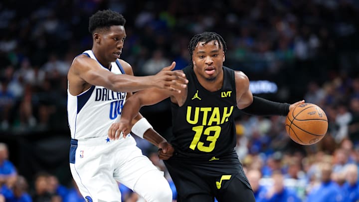 Oct 10, 2024; Dallas, Texas, USA;  Utah Jazz guard Isaiah Collier (13) dribbles as Dallas Mavericks guard Jazian Gortman (00) defends during the second half at American Airlines Center. Mandatory Credit: Kevin Jairaj-Imagn Images
