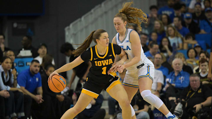 Feb 1, 2026; Los Angeles, California, USA; UCLA Bruins guard Gianna Kneepkens (8) defends Iowa Hawkeyes guard Taylor Stremlow (1) in the first half at Pauley Pavilion presented by Wescom Financial. Mandatory Credit: Jayne Kamin-Oncea-Imagn Images Feb 1, 2026; Los Angeles, California, USA; UCLA Bruins guard Gianna Kneepkens (8) defends Iowa Hawkeyes guard Taylor Stremlow (1) in the first half at Pauley Pavilion presented by Wescom Financial. Mandatory Credit: Jayne Kamin-Oncea-Imagn Images
