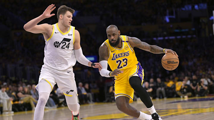 Feb 10, 2025; Los Angeles, California, USA; Los Angeles Lakers forward LeBron James (23) Utah Jazz center Walker Kessler (24) in the first half at Crypto.com Arena. Mandatory Credit: Jayne Kamin-Oncea-Imagn Images
