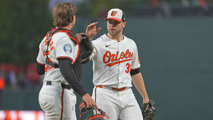 Aug 22, 2024; Baltimore, Maryland, USA; Baltimore Orioles pitcher Corbin Burnes (39) greeted by catcher Adley Rutschman (35) at the end of the third inning against the Houston Astros at Oriole Park at Camden Yards.