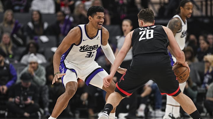 Jan 11, 2026; Sacramento, California, USA; Sacramento Kings center Dylan Cardwell (32) smiles while guarding Houston Rockets center Alperen Sengun (28) during the second quarter at Golden 1 Center. Mandatory Credit: Justine Willard-Imagn Images