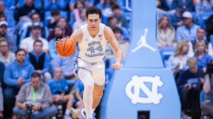 Nov 18, 2025; Chapel Hill, North Carolina, USA; North Carolina Tar Heels guard Luka Bogavac (44) brings the ball up court against the Navy Midshipmen during the second half at Dean E. Smith Center. 