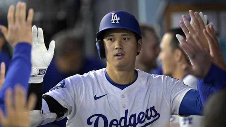 Apr 16, 2025; Los Angeles, California, USA;  Los Angeles Dodgers designated hitter Shohei Ohtani (17) is congratulated after a solo home run in the first inning against the Colorado Rockies at Dodger Stadium. Mandatory Credit: Jayne Kamin-Oncea-Imagn Images
