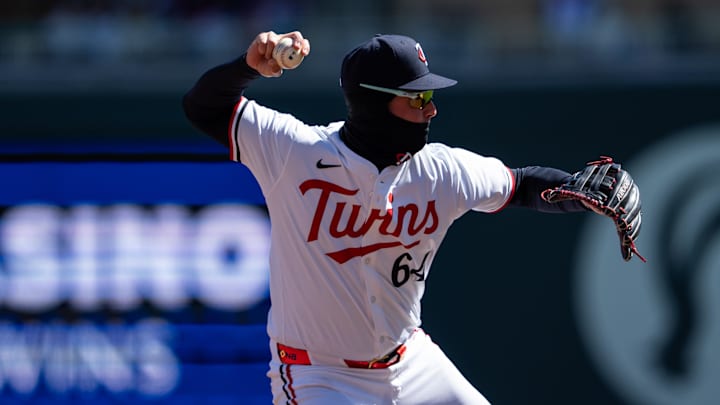 Apr 5, 2025; Minneapolis, Minnesota, USA; Minnesota Twins third baseman Jose Miranda (64) throws to first base for the out during the third inning against the Houston Astros at Target Field. Mandatory Credit: Jordan Johnson-Imagn Images