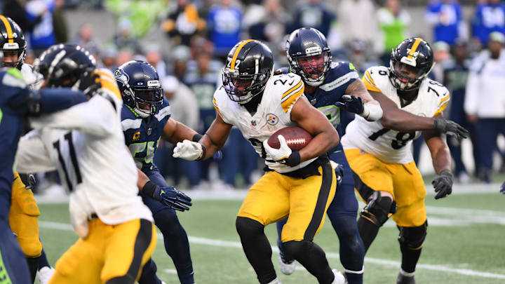 Dec 31, 2023; Seattle, Washington, USA; Pittsburgh Steelers running back Najee Harris (22) carries the ball against the Seattle Seahawks during the second half at Lumen Field. Mandatory Credit: Steven Bisig-Imagn Images