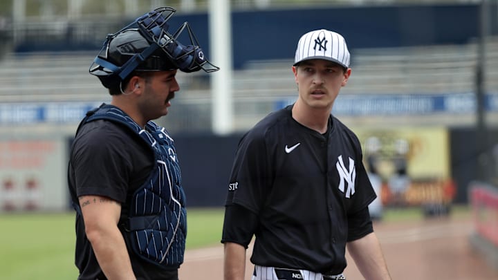Feb 20, 2025; Tampa, FL, USA; New York Yankees pitcher Max Fried (54) and catcher Austin Wells (28) talk at George M. Steinbrenner Field.