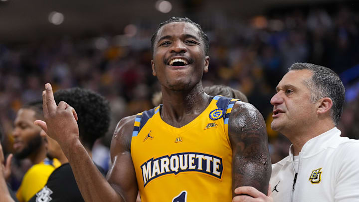 Dec 7, 2024; Milwaukee, Wisconsin, USA;  Marquette Golden Eagles guard Kam Jones (1) celebrates following the game against the Wisconsin Badgers at Fiserv Forum. Mandatory Credit: Jeff Hanisch-Imagn Images