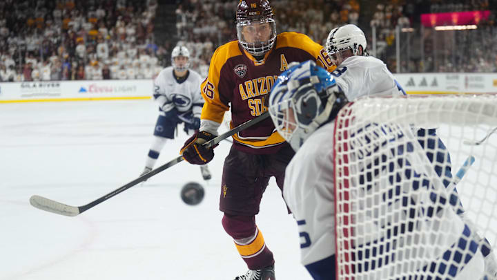 Oct 3, 2025; Tempe, AZ, USA; Penn State Nittany Lions goalie Kevin Reidler (35) makes a save against Arizona State Sun Devils forward Sean McGurn (16) during the third period at Mullett Arena. Mandatory Credit: Joe Camporeale-Imagn Images
