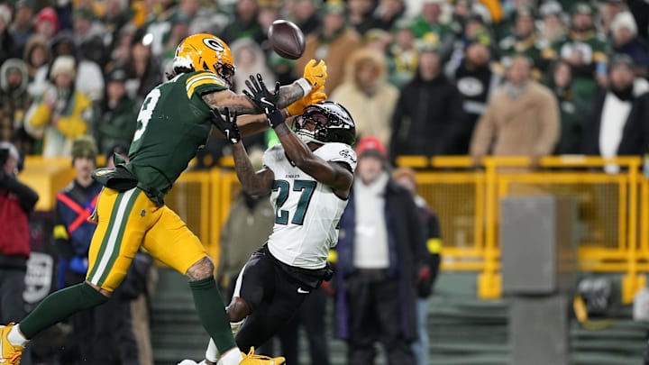 Nov 10, 2025; Green Bay, Wisconsin, USA; Green Bay Packers wide receiver Christian Watson (9)  is defended by Philadelphia Eagles cornerback Quinyon Mitchell (27) n the first half at Lambeau Field. Mandatory Credit: Jeff Hanisch-Imagn Images