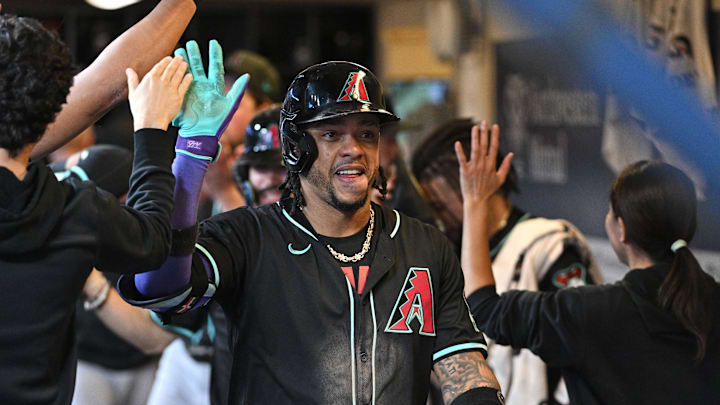 Sep 21, 2024; Milwaukee, Wisconsin, USA; Arizona Diamondbacks second base Ketel Marte (4) celebrates in the dug out after hitting a home run against the Milwaukee Brewers in the ninth inning at American Family Field. Mandatory Credit: Michael McLoone-Imagn Images