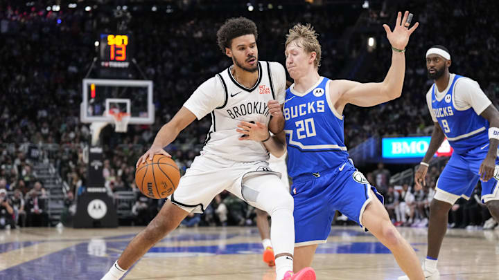 Dec 26, 2024; Milwaukee, Wisconsin, USA;  Brooklyn Nets forward Cameron Johnson (2) drives for the basket against Milwaukee Bucks guard AJ Green (20) during the fourth quarter at Fiserv Forum. Mandatory Credit: Jeff Hanisch-Imagn Images