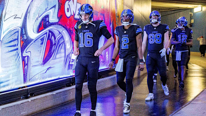 Jan 5, 2025; Detroit, Michigan, USA; Detroit Lions quarterback Jared Goff (16), quarterback Hendon Hooker (2) and running back Craig Reynolds (13) walk out to the field for warm ups before the game against the Minnesota Vikings at Ford Field. Mandatory Credit: David Reginek-Imagn Images