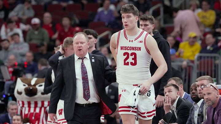 Wisconsin head coach Greg Gard is shown with forward Will Garlock (23) during the first half of their third round game of the Big Ten tournament against Washington Thursday, March 12, 2026 at the United Center in Chicago, Illinois.
