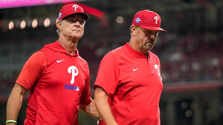 Philadelphia Phillies manager Don Mattingly (8) walks infield coach Bobby Dickerson off of the field after arguing with umpires in the eighth inning of the MLB National League game between the Cincinnati Reds and the Philadelphia Phillies at Great American Ball Park in downtown Cincinnati on Tuesday, July 7, 2026. The Reds lost 4-1 to the Phillies.