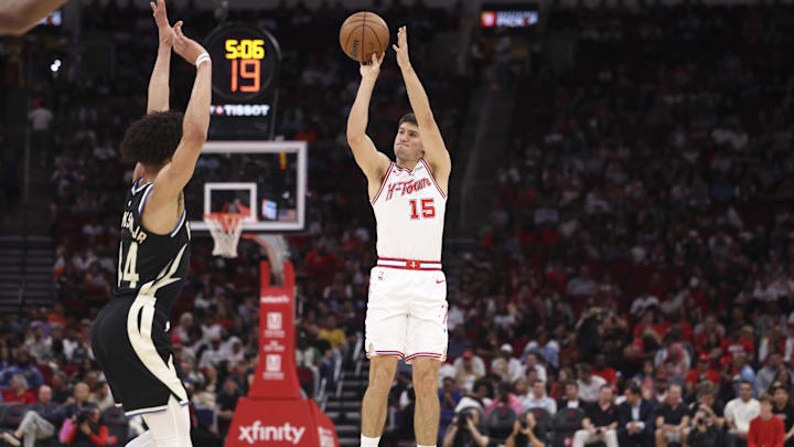 Apr 1, 2026; Houston, Texas, USA; Houston Rockets guard Reed Sheppard (15) shoots the ball during the second quarter against the Milwaukee Bucks at Toyota Center. Mandatory Credit: Troy Taormina-Imagn Images