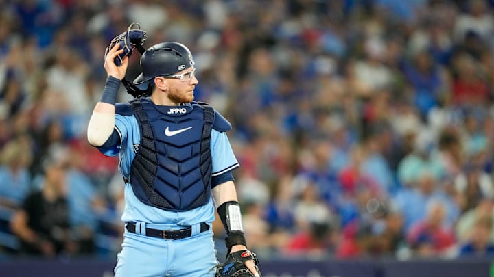 Jul 2, 2023; Toronto, Ontario, CAN; Toronto Blue Jays catcher Danny Jansen (9) takes off his mask at an MLB against the Boston Red Sox at Rogers Centre. Mandatory Credit: Kevin Sousa-USA TODAY Sports