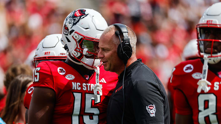 Sep 14, 2024; Raleigh, North Carolina, USA;  North Carolina State Wolfpack tight end Justin Joly and head coach Dave Doeren talk during the second half of the game against Louisiana Tech Bulldogs at Carter-Finley Stadium. 