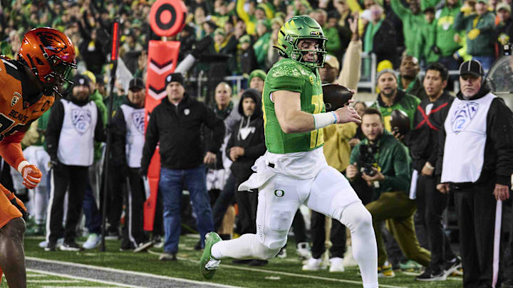 Nov 24, 2023; Eugene, Oregon, USA; Oregon Ducks quarterback Bo Nix (10) scores a touchdown during