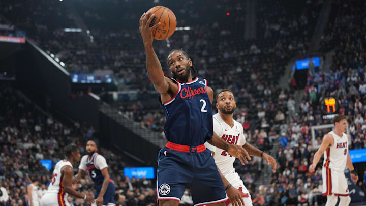Nov 3, 2025; Inglewood, California, USA; LA Clippers forward Kawhi Leonard (2) reaches for the ball against Miami Heat guard Norman Powell (24) in the first half at Intuit Dome. Mandatory Credit: Kirby Lee-Imagn Images Nov 3, 2025; Inglewood, California, USA; LA Clippers forward Kawhi Leonard (2) reaches for the ball against Miami Heat guard Norman Powell (24) in the first half at Intuit Dome. Mandatory Credit: Kirby Lee-Imagn Images