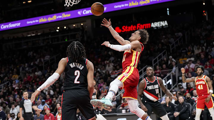 Mar 3, 2023; Atlanta, Georgia, USA; Atlanta Hawks guard Trae Young (11) shoots at the basket behind Portland Trail Blazers forward Trendon Watford (2) during the second half at State Farm Arena. Mandatory Credit: Dale Zanine-Imagn Images