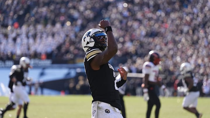 Nov 29, 2024; Boulder, Colorado, USA; Colorado Buffaloes quarterback Shedeur Sanders (2) celebrates a third-quarter touchdown pass against the Oklahoma State Cowboys at Folsom Field. 
