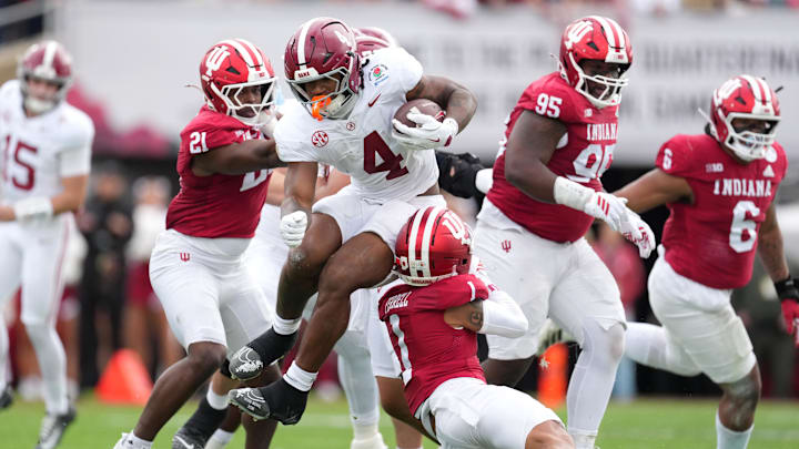 Jan 1, 2026; Pasadena, CA, USA; Alabama Crimson Tide running back Daniel Hill (4) runs against Indiana Hoosiers defensive back Amare Ferrell (1) in the first half of the 2026 Rose Bowl and quarterfinal game of the College Football Playoff at Rose Bowl Stadium. 