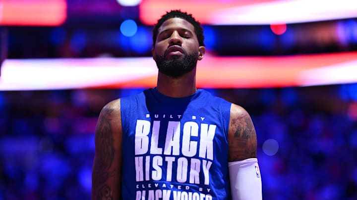 Feb 5, 2025; Philadelphia, Pennsylvania, USA; Philadelphia 76ers forward Paul George (8) observes the national anthem before the game against the Miami Heat at Wells Fargo Center. Mandatory Credit: Kyle Ross-Imagn Images