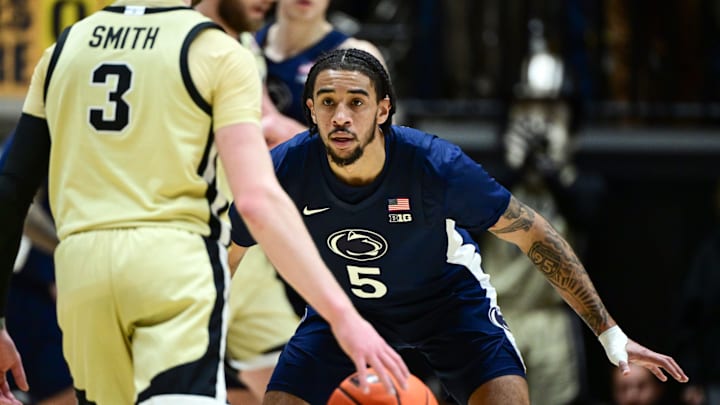 Penn State Nittany Lions guard Freddie Dilione V (5) defends against Purdue Boilermakers guard Braden Smith (3) during the first half at Mackey Arena. 