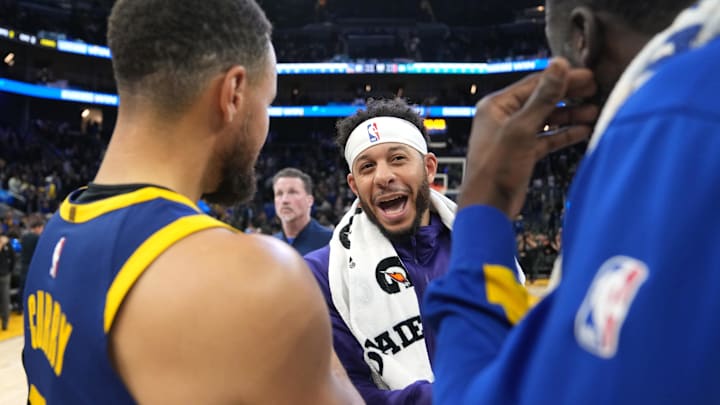Feb 23, 2024; San Francisco, California, USA; Charlotte Hornets guard Seth Curry (center) talks with Golden State Warriors guard Stephen Curry (left) and forward Draymond Green (right) after the game at Chase Center. Mandatory Credit: Darren Yamashita-Imagn Images