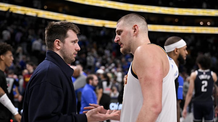 Jan 12, 2025; Dallas, Texas, USA; Dallas Mavericks guard Luka Doncic (left) talks with Denver Nuggets center Nikola Jokic (right) after the game at the American Airlines Center. Mandatory Credit: Jerome Miron-Imagn Images