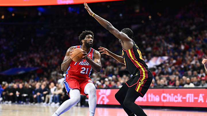Dec 8, 2023; Philadelphia, Pennsylvania, USA; Philadelphia 76ers center Joel Embiid (21) controls the ball against Atlanta Hawks center Clint Capela (15) in the third quarter at Wells Fargo Center. Mandatory Credit: Kyle Ross-Imagn Images
