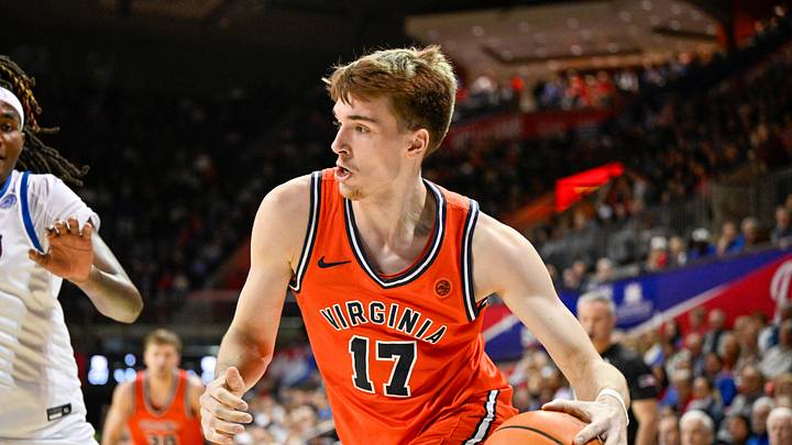 Jan 17, 2026; Dallas, Texas, USA; Virginia Cavaliers center Johann Grunloh (17) moves the ball to the basket against the SMU Mustangs during the first half at Moody Coliseum. Mandatory Credit: Jerome Miron-Imagn Images