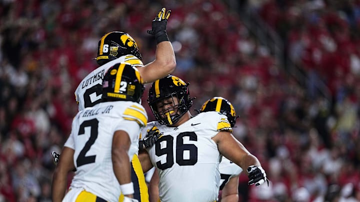 Oct 11, 2025; Madison, Wisconsin, USA; Iowa Hawkeyes defensive lineman Bryce Hawthorne (96) celebrates with teammates after intercepting a pass against the Wisconsin Badgers at Camp Randall Stadium. Mandatory Credit: Ross Harried-Imagn Images
